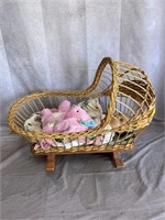 wicker doll bed with dolls