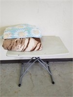 Small fold up table and two blankets