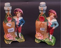 A pair of figural pottery bottles in the majolica