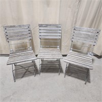 Three vintage slat wood fold up chairs