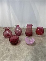 Cranberry colored glass vases and candleholders