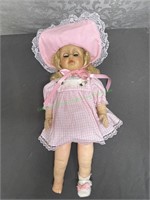 Blonde girl doll in pink dress