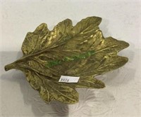 Brass leaf measuring 5 1/2 inches long.