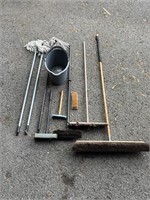 Cleaning lot pushbrooms, squeegees, bucket