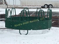 Several round bale feeders