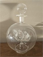 Clear glass ship in a bottle
