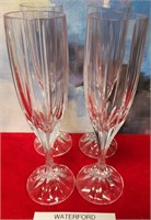 11 - SET OF 4 WATERFORD CRYSTAL FLUTES