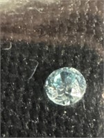 One half carat round cut light blue topaz