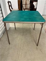 Square folding table with green vinyl top