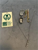 Lot of golf related pins and necklace