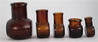 LOT OF FIVE AMBER BOTTLES