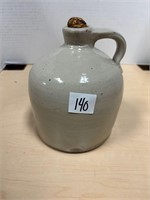 Antique stoneware jug with cork