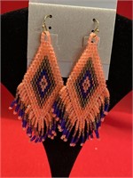 Bead Earrings. Measure over 3 inches long salmon