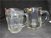 2 VINTAGE 5 “ PRESSED GLASS PITCHERS - SM CHIP ON