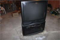 RCA TV/Stand 36" in large case, located basement