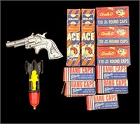 Novelty cap gun & cap rocket along with (10)