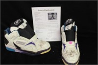 Larry Johnson autographed game worn shoes