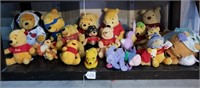 Shelf Full Of Various Winnie The Pooh Bears #3