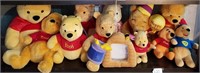 Shelf Full Of Various Winnie The Pooh Bears #1