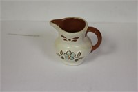 A Miniature Ceramic Pitcher