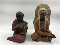 2 native American statues marked C Row 1987