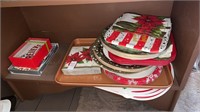 Bottom shelf lot with Christmas Plates, Napkins,