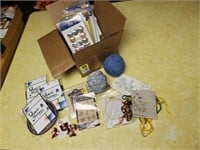 Box of yo-yo's, needlepoint sampler kit, buttons