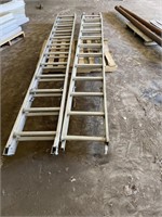pair of extension ladders, 1 has no feet.
