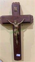 Wall crucifix candle holder with one candle and