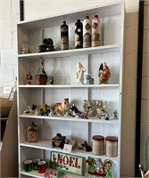 Everything on the shelves - Antique dog figurines