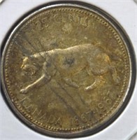 Silver 1967 Canadian centennial quarter