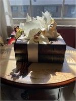 Decorative books with flower arrangement