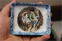 An Enamel Dish Depicting Two Young Children