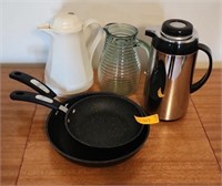 Frying pans, coffee carafe, juice pitchers.
