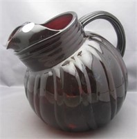 Ruby glass pitcher. Measures 7.5" tall.