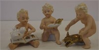 Three German children figurines