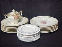 Group of glass plates and royal doulton saucers.