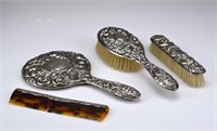 Four piece English silver vanity set