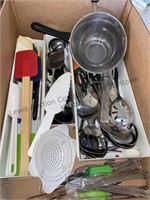 Box of kitchen utensils including spatulas,