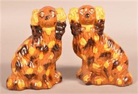 Pair of PA 19th Century Glazed Redware Spaniels.