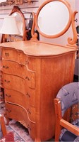 Double-serpentine birdseye maple dresser