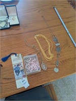 2 bookmarks, and 4 necklaces
