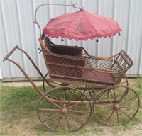 Antique wicker baby buggy with original parasol
