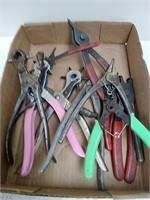 A group of miscellaneous pliers/ leather hole