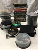 Assortment of DVDs and CDs Y7E