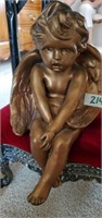 Cherub sitting figurine