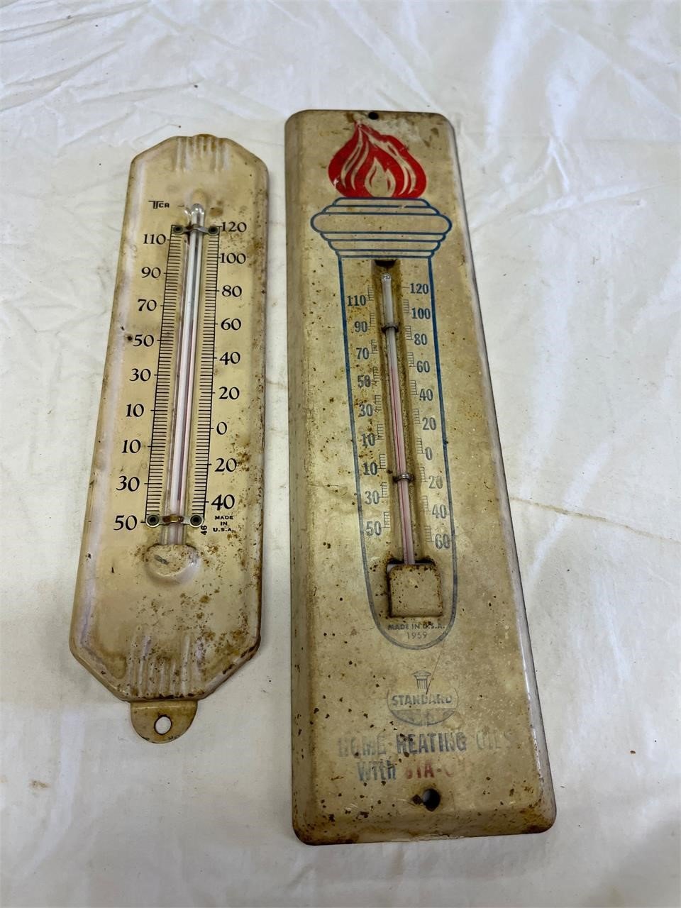 Standard Oil thermometer plus unmarked one.