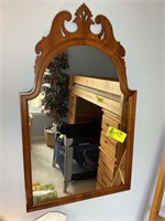 Brown wood framed wall hanging mirror