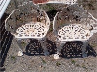 2 cast iron chairs