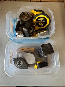 Assorted measuring tapes and tools
